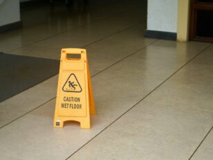 yellow caution wet floor sign